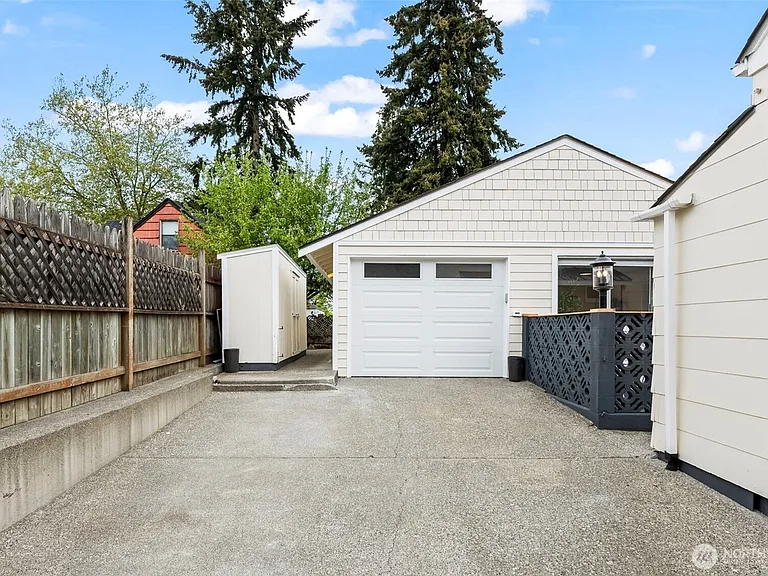 Attached to garage. Garage NOT INCLUDED in rental. ONE long 
off-street parking space included. Plenty of additional street parking. Street is wide.
