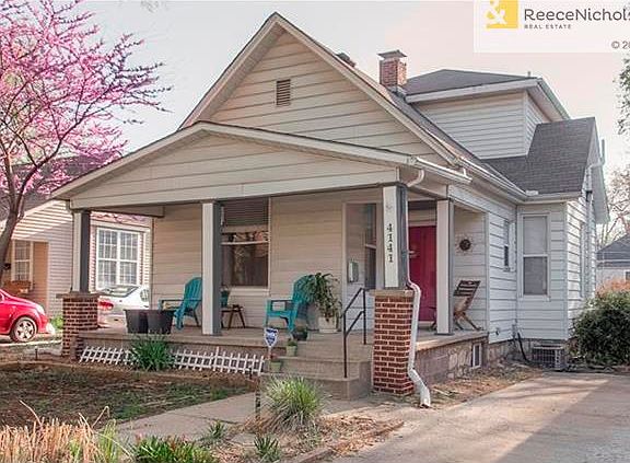 Welcoming front porch invites to 4141 Bell Street