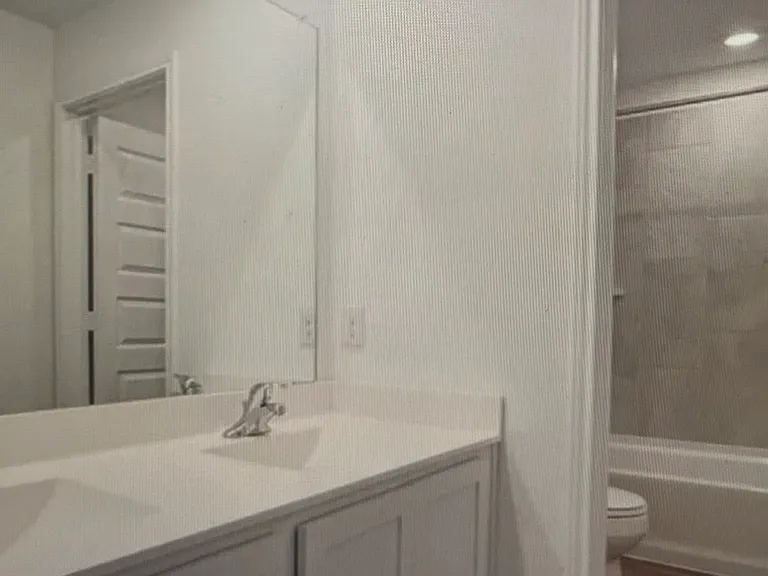 Second full bathroom upstairs with double vanity.