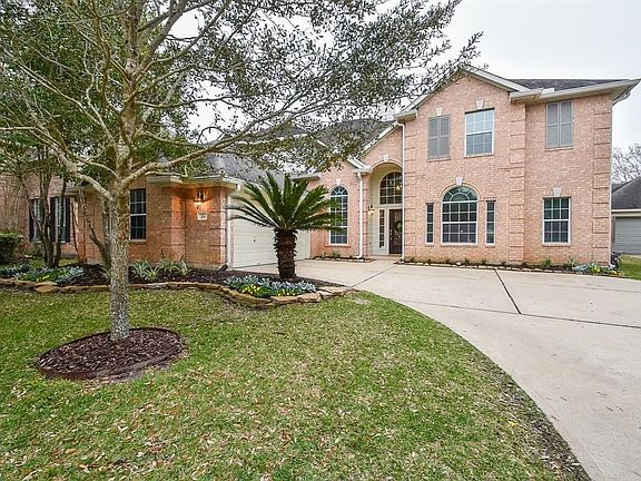 Nice wide driveway leads you into a two car attached garage. Sprinkler system in the yard. Beautiful sago palm and enhanced landscaping.