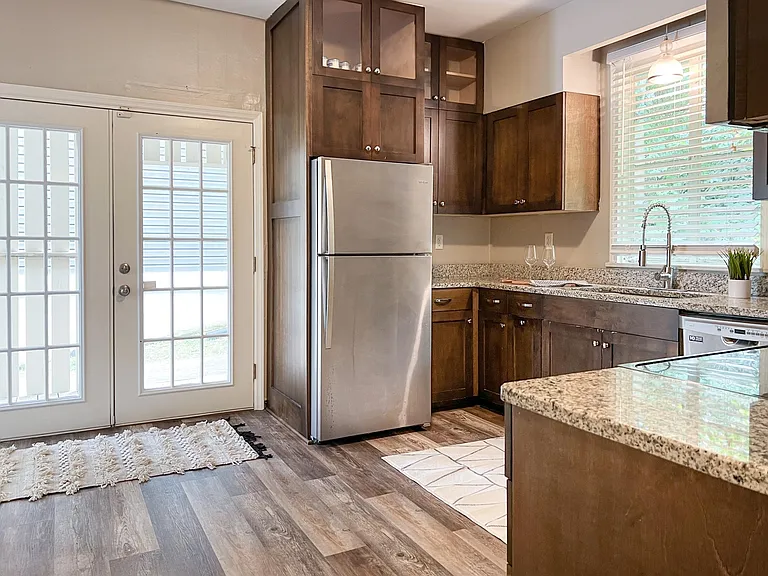 Updated kitchen with stainless appliances and granite countertops