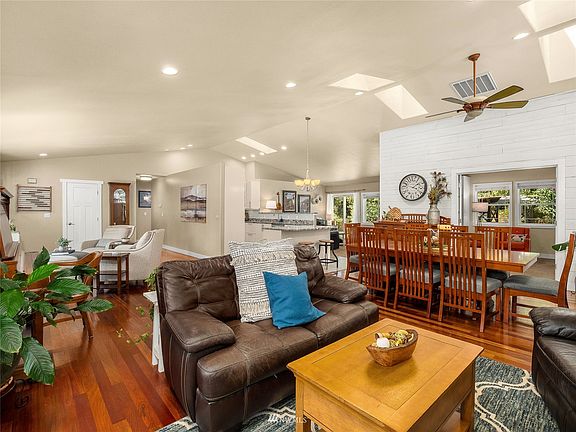 Refreshing open concept living boasting a warm greeting of Brazilian cherry hardwood floors.>