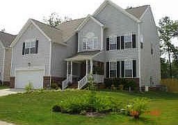 Spacious and Gracious with covered front porch and fenced backyard