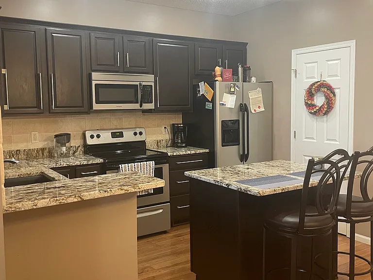 Kitchen. White door leads to half bath
