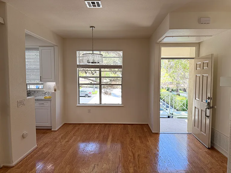 View from living room toward dining area and front door.