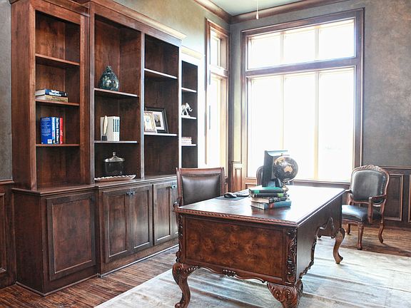 Stunning Study with built-in bookcases and custom painted walls