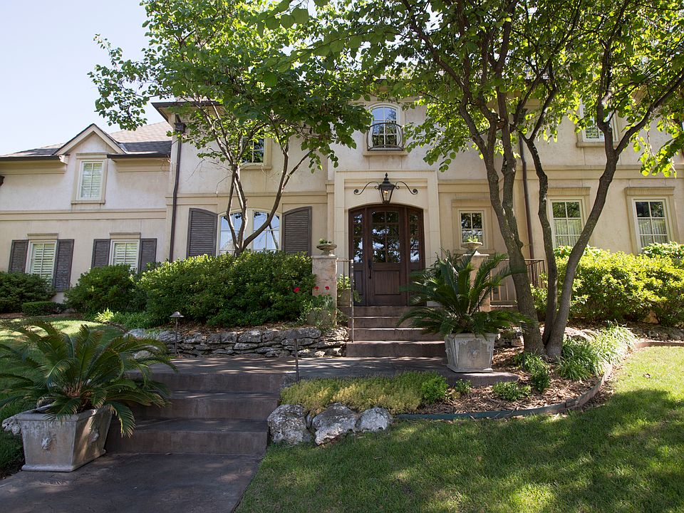 Front view with stained concrete walk and steps