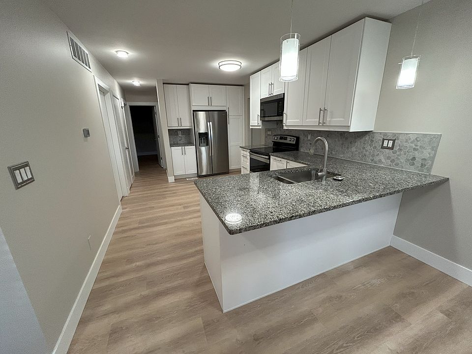 Full eat-in kitchen view - space for a small dining table as well. State of the art, eco-friendly LED lighting.