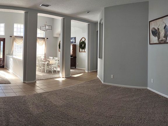 View from extra living area of entrance and dining room