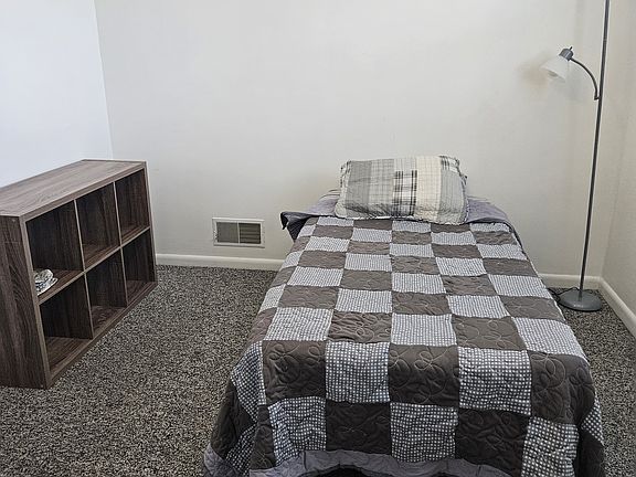 1st bedroom furnished twin bed.