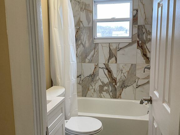 brand new bathroom with tiled flooring