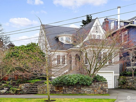 Elegance and Charm abound in this 1928 Remodeled Tudor Home!>