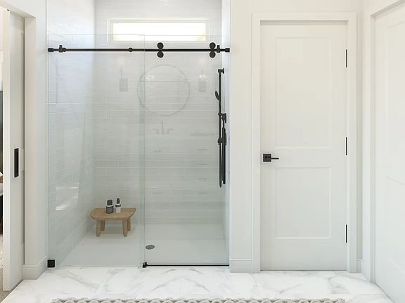 Primary bath with glass shower enclosure