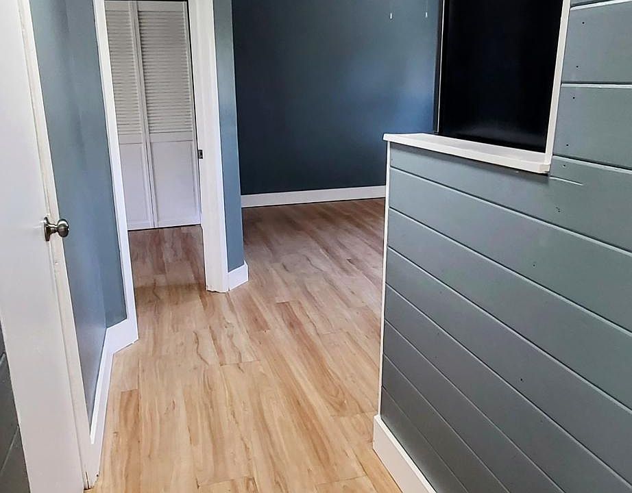 Walkway into kitchen (on right) and bedroom