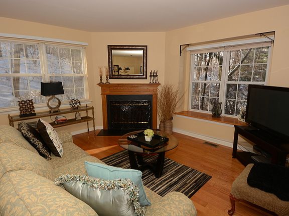 Sun Filled Formal Living Room Boast Gleaming Hardwood Floors
