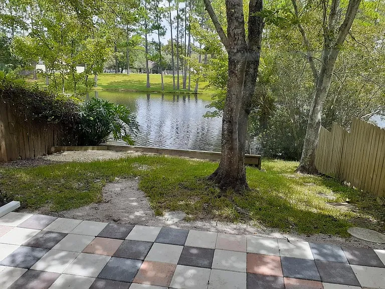 Back yard patio area overlooking pond.