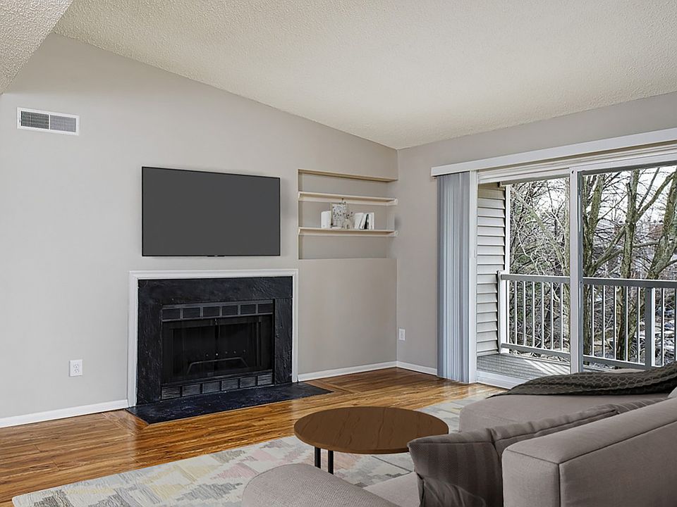 Spacious central living room with wood plank flooring