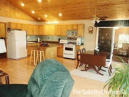 Great Room / Living Room / Kitchen
						:
						Floor to ceiling windows offer a great view as well as abundant natural light.