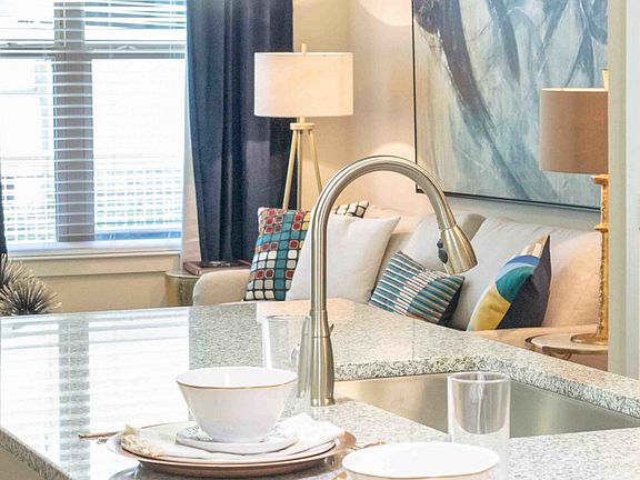 Kitchen island with deep sink and gooseneck faucet