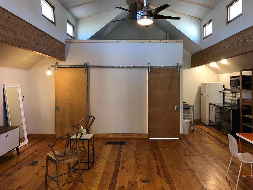 These 2 closed doors share one rail, the door on the right leads downstairs to the entrance and the one on the left is the bathroom.