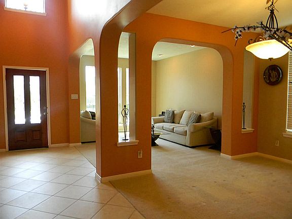  THE FORMAL LIVING AND DINING COMBO IS SITUATED RIGHT OFF THE ENTRY OFFERING LOTS OF LIVING SPACE IN THIS HOME.