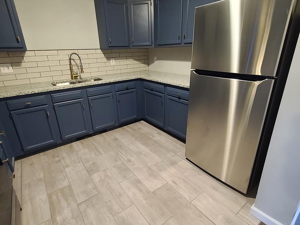 Renovated kitchen - new tile floor, new stainless steel appliances, new granite countertop with tile backsplash