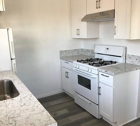 New Kitchen Cabinets, Laminate Flooring, Stainless Hood