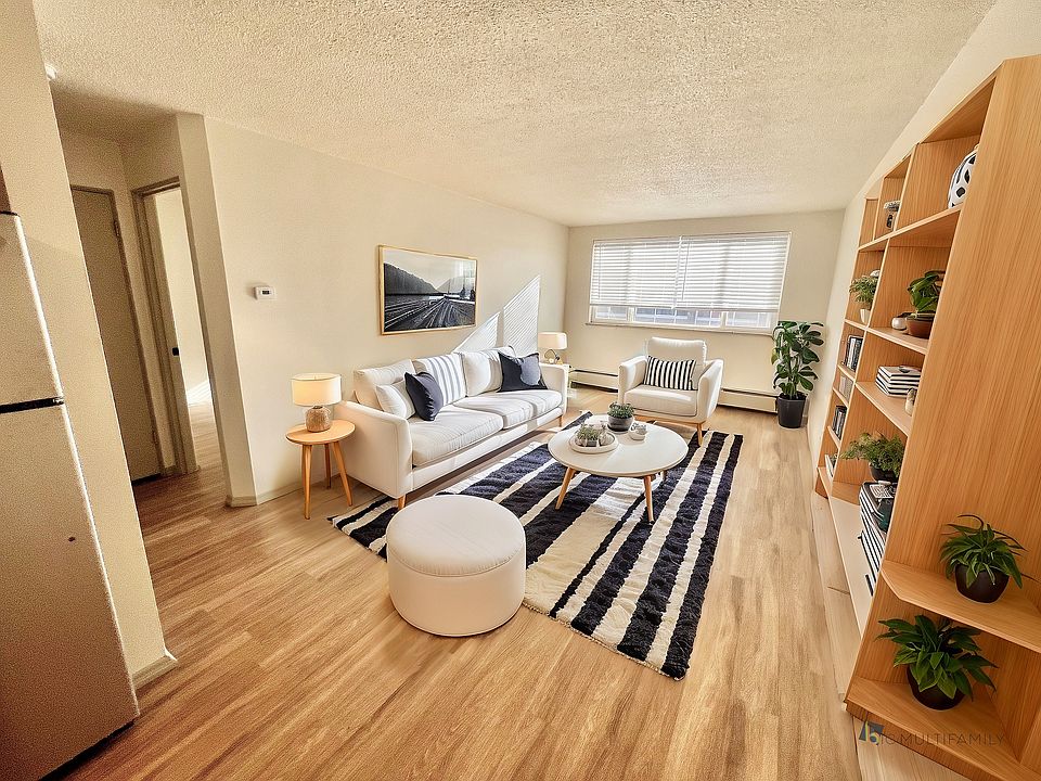 Step into a warm and stylish living space designed for relaxation.
