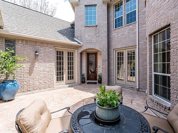 Awesome courtyard with stamped concrete and gutters.