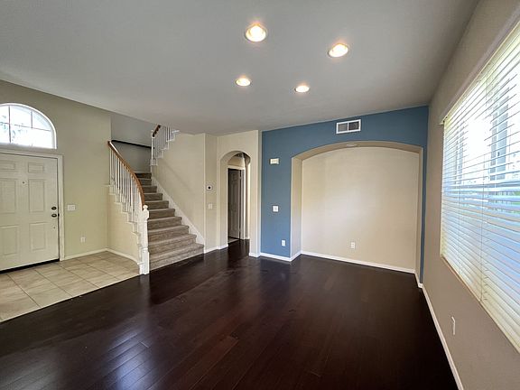 Great room: living and dining area with recessed nook for a credenza, cocktail/bar area, decorating, or whatever suits your style.