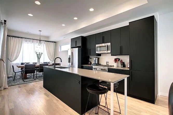 This fully-stocked kitchen is a jaw-dropper with its incredibly beautiful cabinets and granite counter tops!