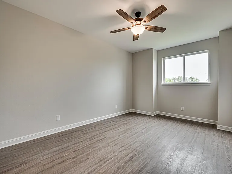 Beautiful and spacious second bedroom with a huge walk-in closet. Notice no carpet all through the house