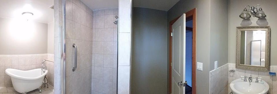 Generous sized bathroom with Stand-up shower and bathtub. Sh