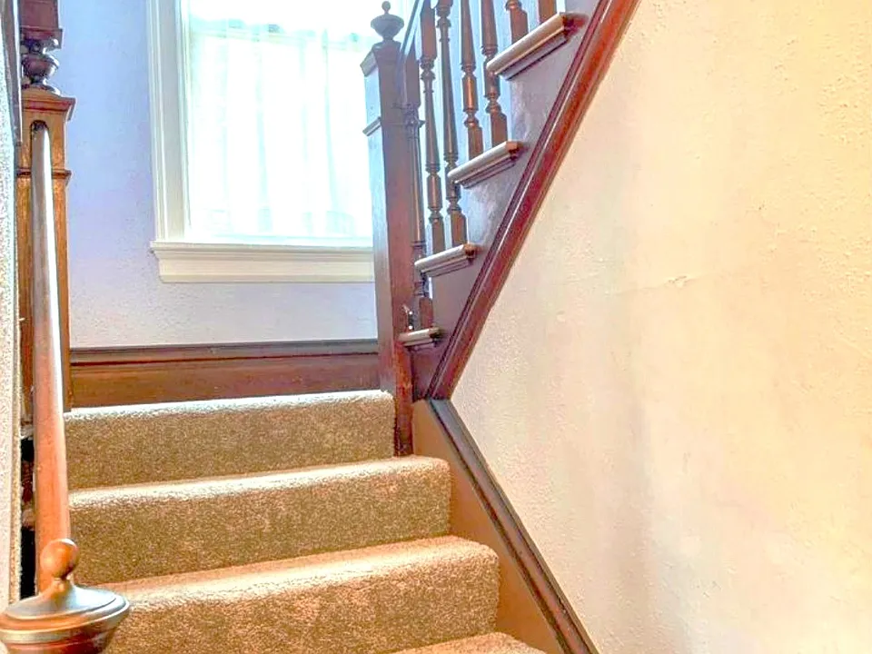 There is an amazing built-in on the way UP the stairs!