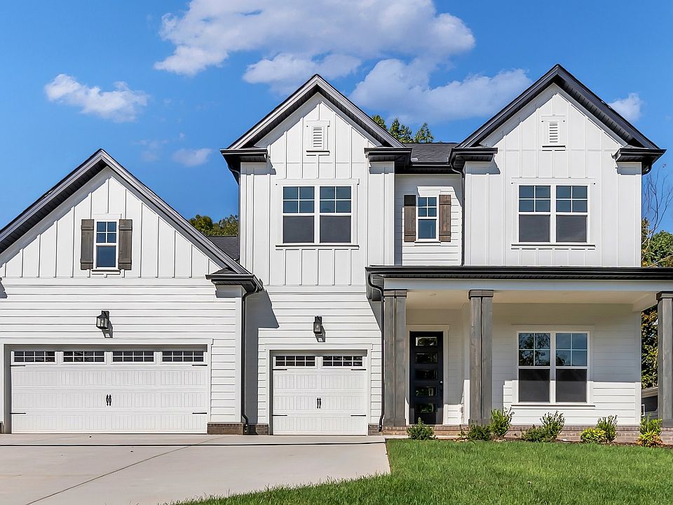 Luxurious house with timeless design, black accents, and pristine landscaping in Roan at Brush Creek