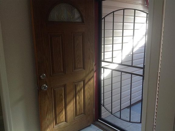 The entryway has a secured metal screen door if you wanted to open up the front door and let some fresh air inside.