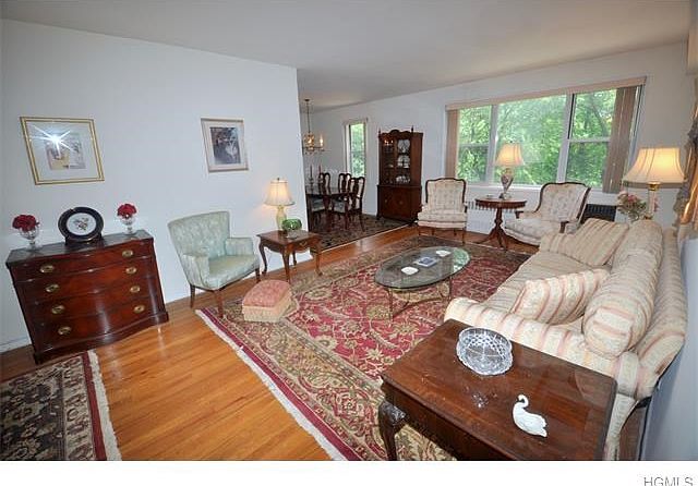 Living room opens to the entry foyer and "L" shape dining room.