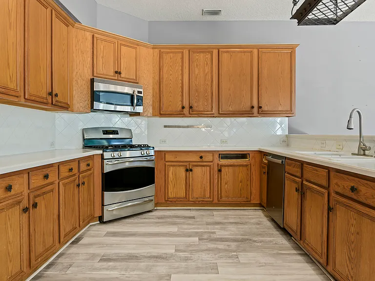 Kitchen with wood cabinets and lots of storage space
Knife rack on backsplash / gas range