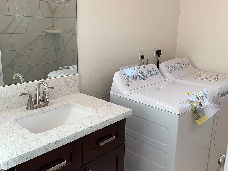 sink and brand new washer dryer