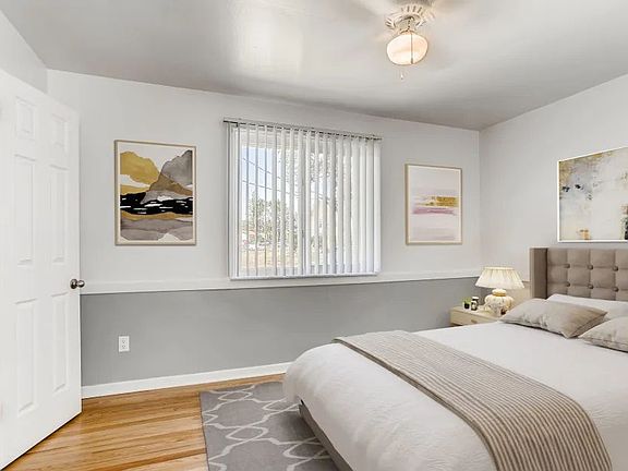 model bedroom with modern look in model home with window