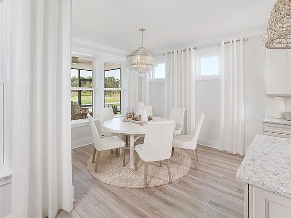 Enjoy a meal in the Dining area. Model shown.