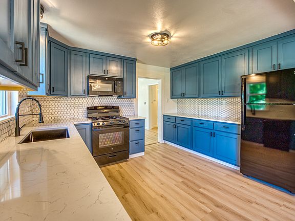 Kitchen looking into living room