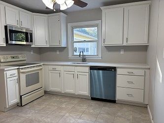 Renovated Kitchen; New Cabinets, Countertops and sink.