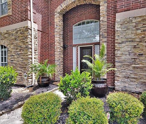 Professionally landscaped beds add to the Curb Appeal!  You will find mature shade trees,palms and flowering perennials.  Landscape beds bordered with stacked stone.