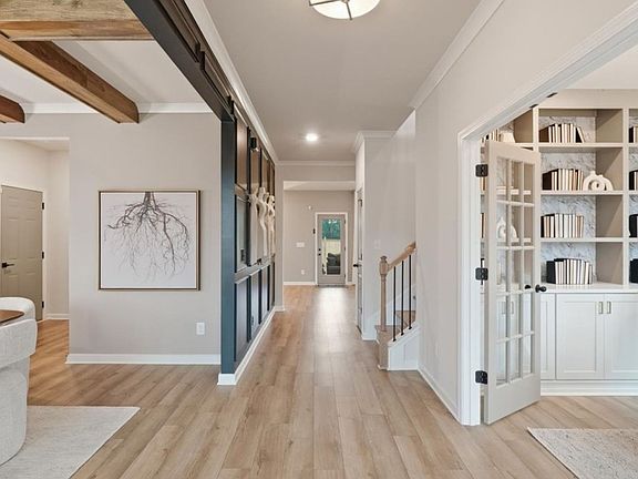 Stonefield open foyer with LVP flooring and views to dining room and study at Brighton in Locust Gro