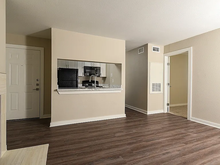 Designer One Bedroom Living Area with Kitchen View