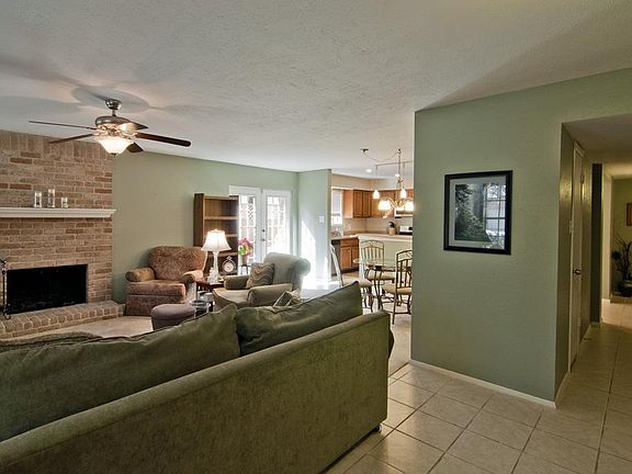 Straight ahead is the hallway leading to the bedrooms/baths. To the left are the magnificent Living 