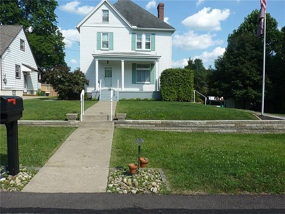 Driveway has enough room for 3 cars, as well as on-street parking.