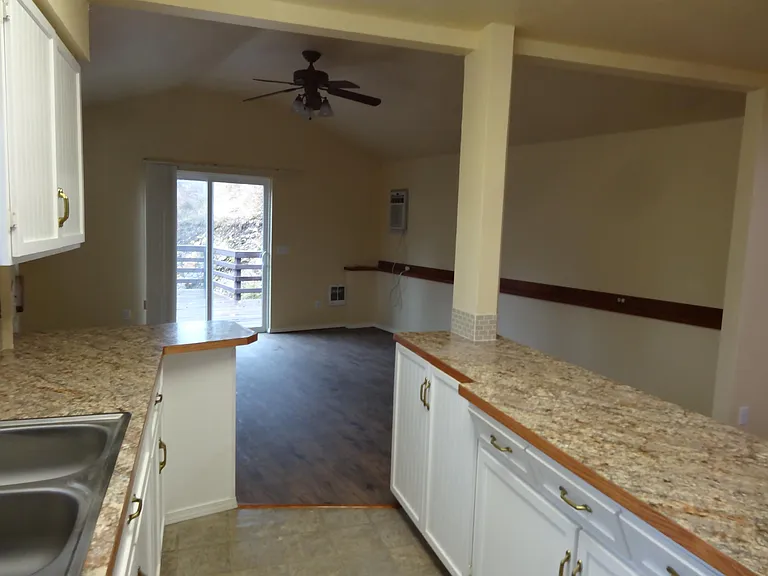 view from kitchen to great room and large deck