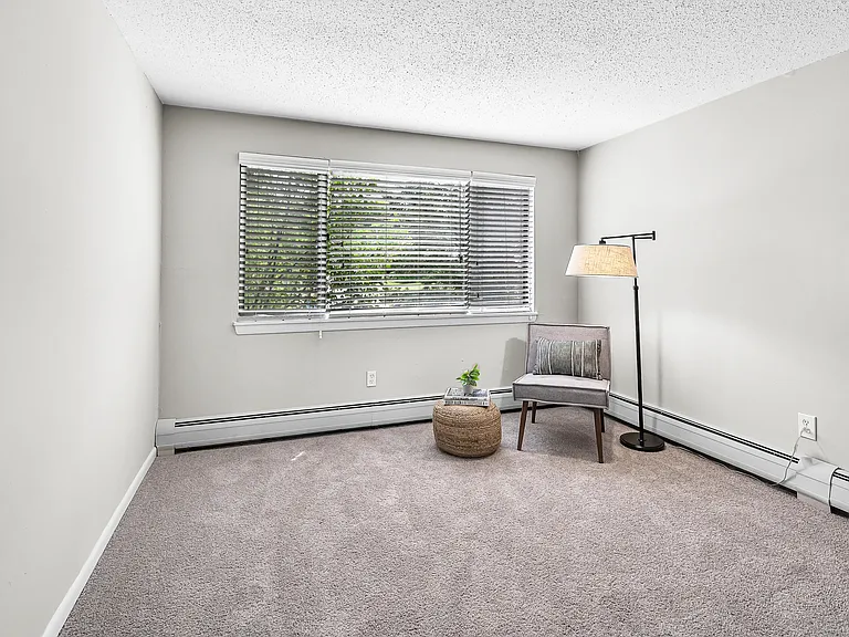 Discover comfort in our cozy bedroom, a serene haven for delightful dreams, with abundant natural light and baseboard heaters for the ultimate coziness.